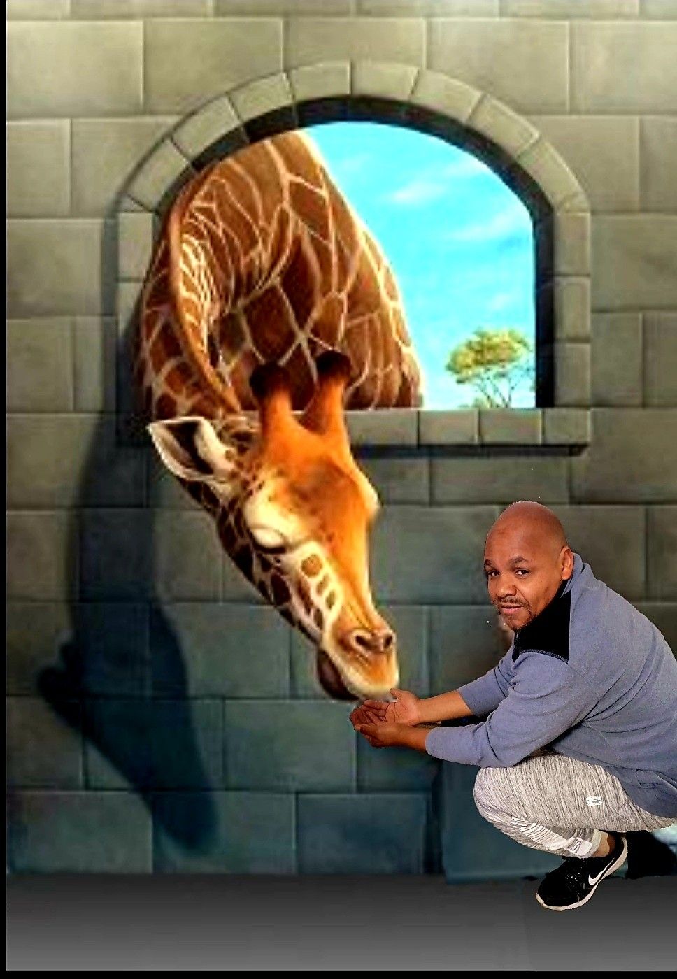 Artist painting a large wall mural on site